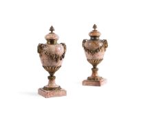 A PAIR OF GILT METAL MOUNTED RED VEINED BEIGE MARBLE URNS AND COVERS OF LOUIS XVI STYLE