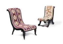 TWO MID VICTORIAN EBONISED AND BRASS MOUNTED NEEDLEWORK COVERED SLIPPER CHAIRS, CIRCA 1870