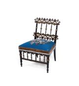 A BLACK AND POLYCHROME PAINTED AND PARCEL GILT LOW CHAIR, 19TH CENTURY