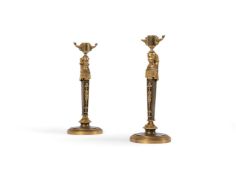 A PAIR OF FRENCH EMPIRE GILT AND PATINATED BRONZE CANDLESTICKS, EARLY 19TH CENTURY