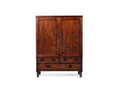 Y A REGENCY MAHOGANY, EBONY AND EBONISED CAMPAIGN STYLE CLOTHES PRESS, CIRCA 1820
