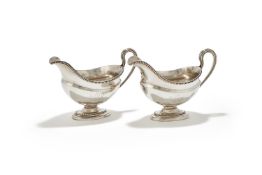 A PAIR OF GEORGE III SILVER OVAL SAUCEBOATS, DANIEL SMITH & ROBERT SHARP, LONDON 1774 AND 1778