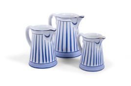 A GRADUATED SET OF THREE POTTERY JUGS, PORTUGUESE