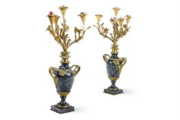 A PAIR OF ORMOLU MOUNTED BLACK MARBLE FOUR LIGHT CANDELABRA OF LOUIS XVI STYLE