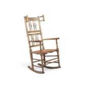 A CREAM PAINTED ASH AND BEECH SPINDLE BACK ROCKING CHAIR, EARLY 19TH CENTURY