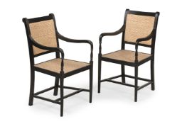 Y A PAIR OF EBONY ARMCHAIRS, IN GEORGE III STYLE, LATE 20TH OR EARLY 21ST CENTURY