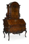 A CONTINENTAL CARVED AND FIGURED WALNUT BUREAU CABINET, LATE 18TH OR EARLY 19TH CENTURY