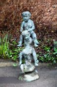 A BRONZE FOUNTAINHEAD MODELLED AS THREE CHILDREN, CONTEMPORARY