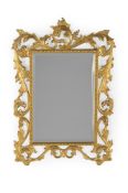 A CARVED WOOD AND GILT GESSO RECTANGULAR WALL MIRROR, FLORENTINE, LATE 19TH OR EARLY 20TH CENTURY