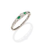 AN EMERALD AND DIAMOND BANGLE