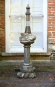 A LARGE CARVED CORNISH SERPENTINE LIGHTHOUSE LAMP ON PEDESTAL, LATE 19TH OR EARLY 20TH CENTURY