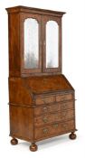 A GEORGE I BURR WALNUT AND FEATHERBANDED BUREAU BOOKCASE, CIRCA 1720
