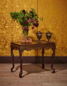 A CHINESE EXPORT BLACK LACQUER AND GILT CHINOISERIE DECORATED CENTRE OR SIDE TABLE