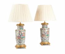 A PAIR OF CHINESE FAMILLE ROSE GILT METAL MOUNTED VASE TABLE LIGHTS, 19TH OR 20TH CENTURY
