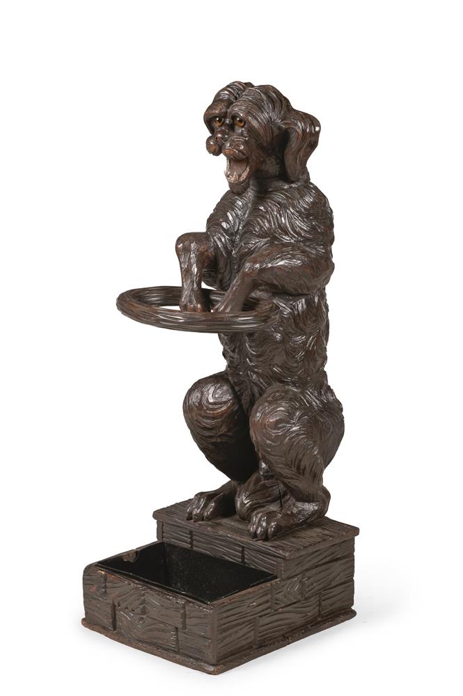 A BLACK FOREST CARVED LINDEN WOOD DOG STICK STAND, LATE 19TH CENTURY