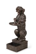 A BLACK FOREST CARVED LINDEN WOOD DOG STICK STAND, LATE 19TH CENTURY