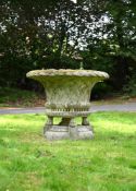 A LARGE COMPOSITION STONE BASKET WEAVE PLANTER, LATE 20TH CENTURY