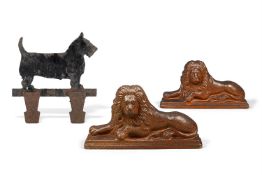 TWO SIMILAR BROWN SALT-GLAZED STONEWARE DOOR STOPS OR DOOR PORTERS MODELLED AS RECUMBENT LIONS