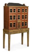 A LARGE POLYCHROME PAINTED GEORGIAN DOLL'S HOUSE, FIRST HALF 19TH CENTURY, ON A LATER STAND