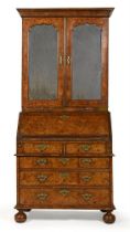 A GEORGE I BURR WALNUT AND FEATHERBANDED BUREAU BOOKCASE, CIRCA 1720