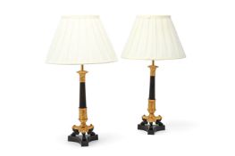 A PAIR OF GILT AND PATINATED BRONZE CANDLESTICK TABLE LIGHTS, EARLY 19TH CENTURY