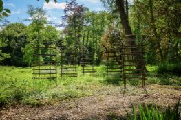 A SET OF FIVE LARGE IRON CIRCULAR TREE GUARDS, CONTEMPORARY