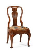 A GEORGE II CARVED WALNUT AND NEEDLEWORK UPHOLSTERED CHAIR, CIRCA 1740