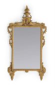 AN ITALIAN CARVED GILTWOOD MIRROR, CIRCA 1780