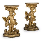 A PAIR OF ITALIAN CARVED GILTWOOD FIGURAL CONSOLE TABLES, EARLY 18TH CENTURY