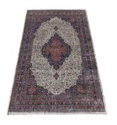 † AN AMRITSAR CARPET, OF KIRMAN DESIGN, CIRCA 1900