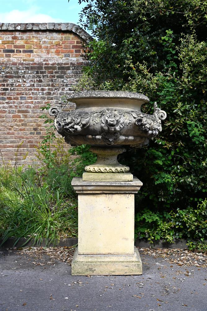 A LARGE COMPOSITION STONE LION MASK URN ON STAND, LATE 20TH CENTURY