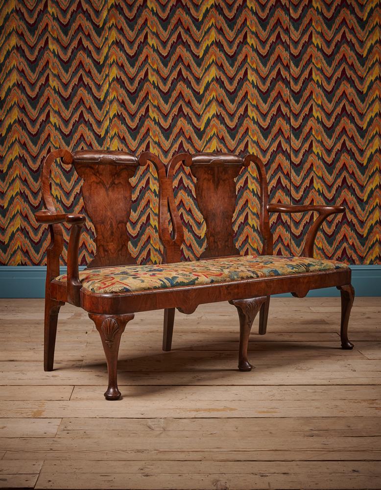 A GEORGE II WALNUT SETTEE, CIRCA 1735