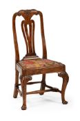A GEORGE II CARVED WALNUT CHAIR, CIRCA 1740