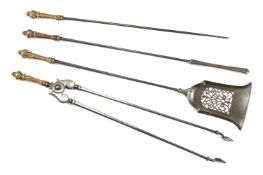 A SET OF FOUR EARLY VICTORIAN BRASS HANDLED STEEL FIRE TOOLS, MID 19TH CENTURY