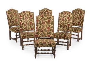 A SET OF SIX WILLIAM & MARY WALNUT AND CREWEL WORK UPHOLSTERED CHAIRS, CIRCA 1690