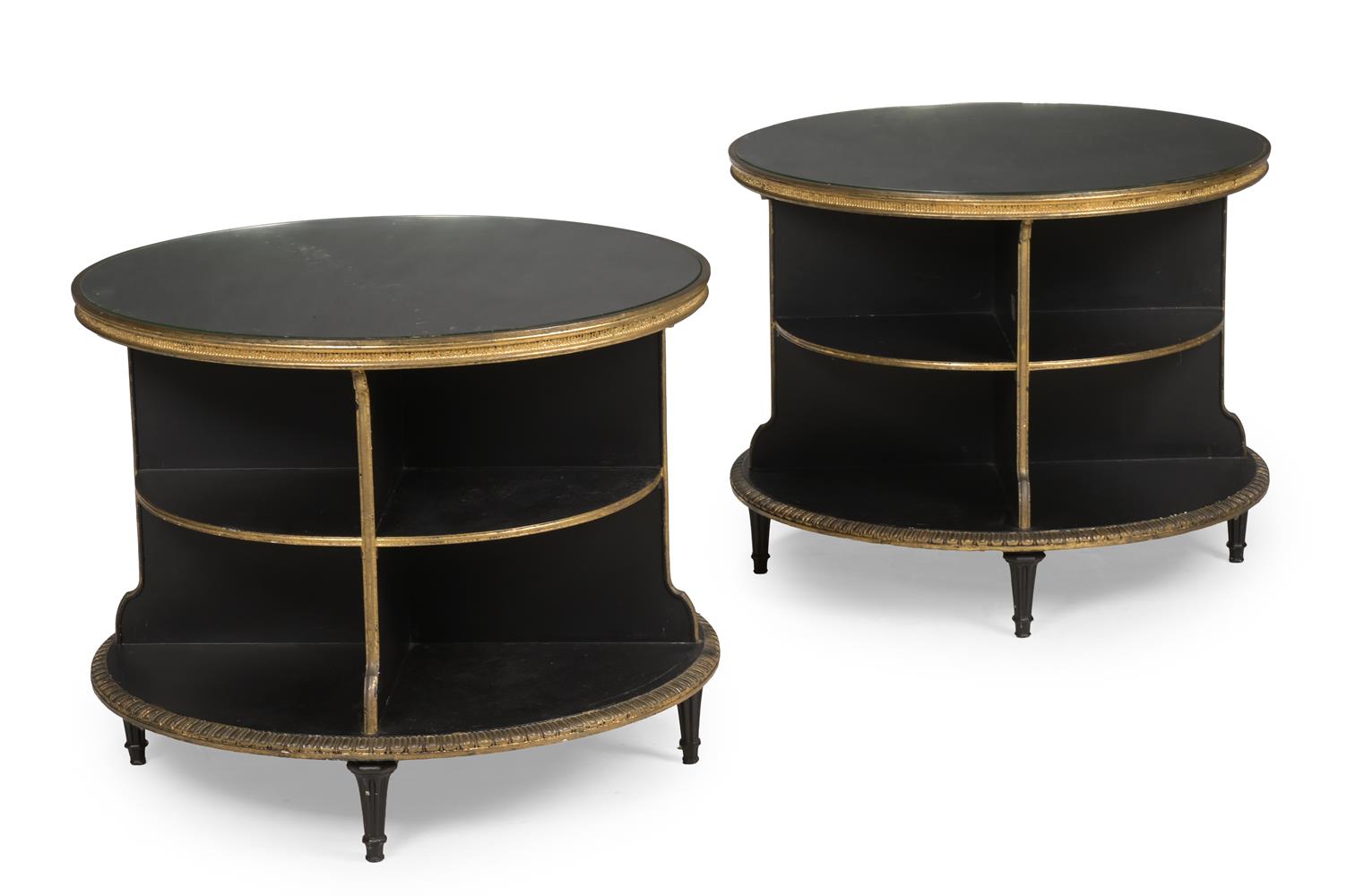 A PAIR OF EBONISED AND PARCEL GILT CIRCULAR LOW OCCASIONAL TABLES OR BOOKCASES, MID 20TH CENTURY