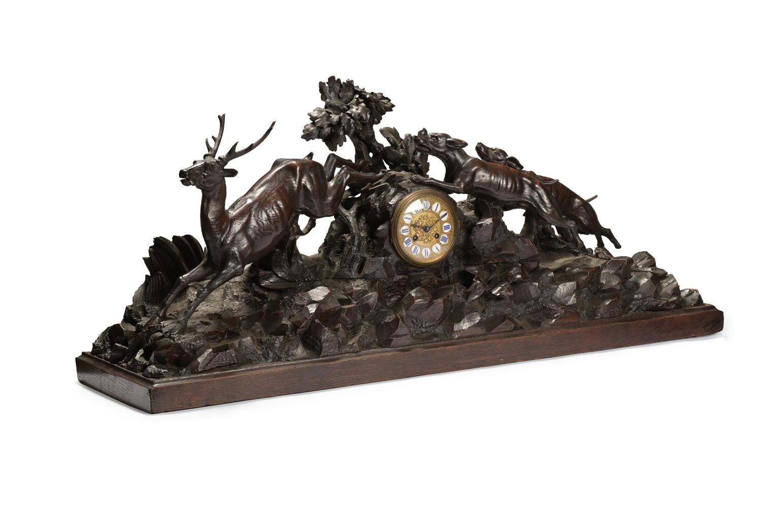 A LARGE GERMAN CARVED BLACK FOREST MANTEL CLOCK, LAST QUARTER 19TH CENTURY