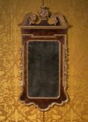 A LARGE GEORGE II WALNUT AND PARCEL GILT MIRROR, CIRCA 1740