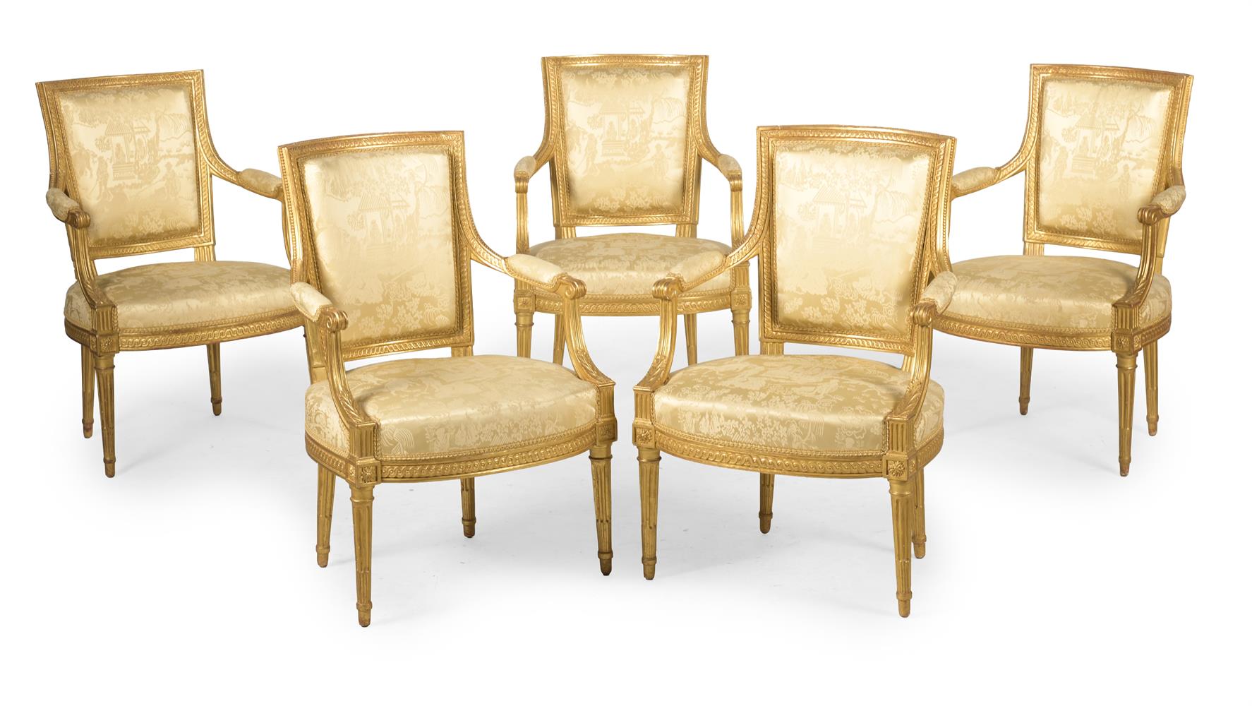 A SET OF FIVE LOUIS XVI CARVED GILT WALNUT ARMCHAIRS, BY HENRI JACOB, CIRCA 1780