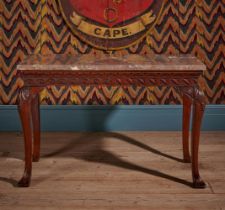 A GEORGE II CARVED MAHOGANY SIDE OR CONSOLE TABLE, IN THE MANNER OF WILLIAM KENT, CIRCA 1750