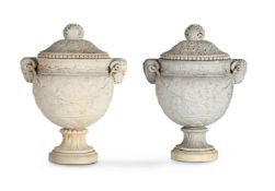AFTER THE ANTIQUE, A MATCHED PAIR OF CARVED WHITE MARBLE 'PIRANESI' URNS