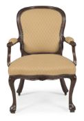 A MAHOGANY AND UPHOLSTERED ARMCHAIR, IN GEORGE II STYLE, FIRST HALF 19TH CENTURY