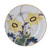 AN ENGLISH DELFT POLYCHROME PLATE, THIRD QUARTER 18TH CENTURY