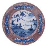 A RARE ENGLISH DELFT BLUE AND MANGANESE-GROUND PLATE, CIRCA 1750