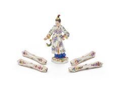 A MEISSEN PORCELAIN MODEL OF JAPANERIN MIT FISCH, 20TH CENTURY, TOGETHER WITH FOUR KNIFE RESTS