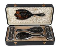 Y A CASED SILVER AND TORTOISESHELL MOUNTED FIVE PIECE DRESSING TABLE SET