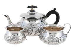 AN EDWARDIAN SILVER THREE PIECE BACHELOR'S TEA SET