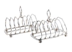 A PAIR OF VICTORIAN SILVER SIX DIVISION TOAST RACKS