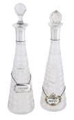 A PAIR OF FRENCH SILVER MOUNTED AND CUT GLASS DECANTERS
