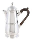 AN EDWARDIAN SILVER HOT WATER JUG